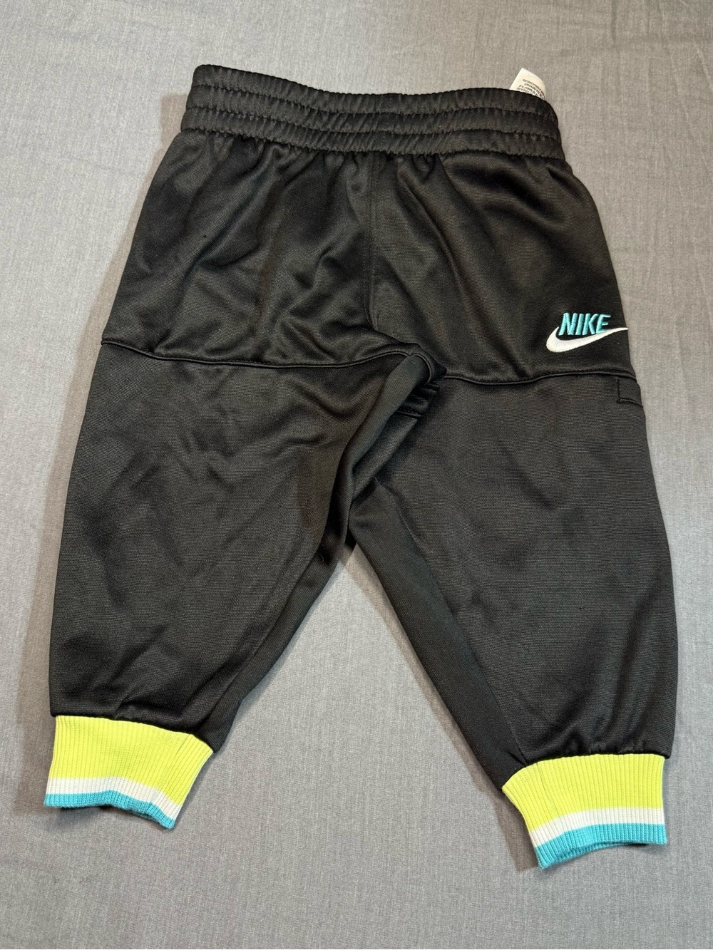 Nike Black Jogger Pants with Yellow & Blue Cuff Accents